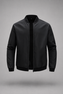Men’s premium minimalist bomber jacket with structured collar and clean tailored silhouette by Thorvyn