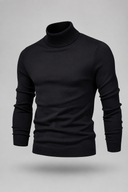Men’s premium white roll neck knitted jumper styled with tailored trousers and black leather boots by Thorvyn