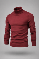 Men’s premium white roll neck knitted jumper styled with tailored trousers and black leather boots by Thorvyn