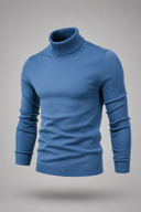 Men’s premium white roll neck knitted jumper styled with tailored trousers and black leather boots by Thorvyn