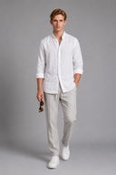 Men’s premium white linen shirt with rolled sleeves and minimalist tailored design by Thorvyn