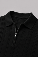 Men's ribbed knit polo featuring a structured collar, quarter-zip fastening and a tailored silhouette.