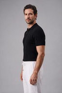 Men's ribbed knit polo featuring a structured collar, quarter-zip fastening and a tailored silhouette.