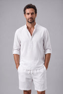 Men's grandad collar shirt featuring a half-button placket, rolled sleeves, curved hem and a clean minimalist design.
