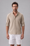 Men's grandad collar shirt featuring a half-button placket, rolled sleeves, curved hem and a clean minimalist design.