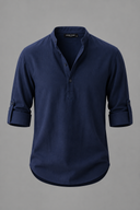 Men's grandad collar shirt featuring a half-button placket, rolled sleeves, curved hem and a clean minimalist design.