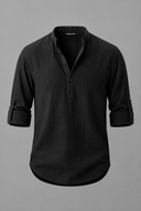 Men's grandad collar shirt featuring a half-button placket, rolled sleeves, curved hem and a clean minimalist design.