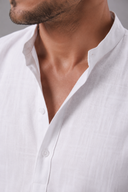 Men's grandad collar shirt featuring a half-button placket, rolled sleeves, curved hem and a clean minimalist design.