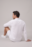 Men's grandad collar shirt featuring a half-button placket, rolled sleeves, curved hem and a clean minimalist design.