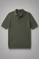 Men’s premium black ribbed knit polo shirt styled with tailored trousers and brown leather loafers by Thorvyn