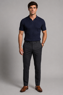 Men’s premium black ribbed knit polo shirt styled with tailored trousers and brown leather loafers by Thorvyn