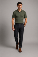 Men’s premium black ribbed knit polo shirt styled with tailored trousers and brown leather loafers by Thorvyn