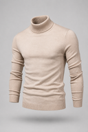 Men’s premium white roll neck knitted jumper styled with tailored trousers and black leather boots by Thorvyn