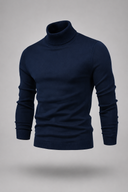 Men’s premium white roll neck knitted jumper styled with tailored trousers and black leather boots by Thorvyn