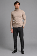 Men’s premium white roll neck knitted jumper styled with tailored trousers and black leather boots by Thorvyn