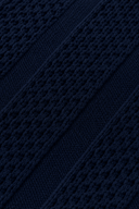 Men's textured knit polo featuring an open collar, vertical textured knit panels and ribbed trims.