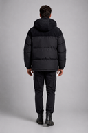 Men’s premium insulated puffer jacket with structured hood and modern minimalist design by Thorvyn