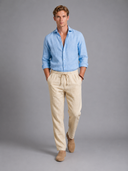 Men’s premium white linen trousers with relaxed tailored fit and adjustable drawstring waistband by Thorvyn 